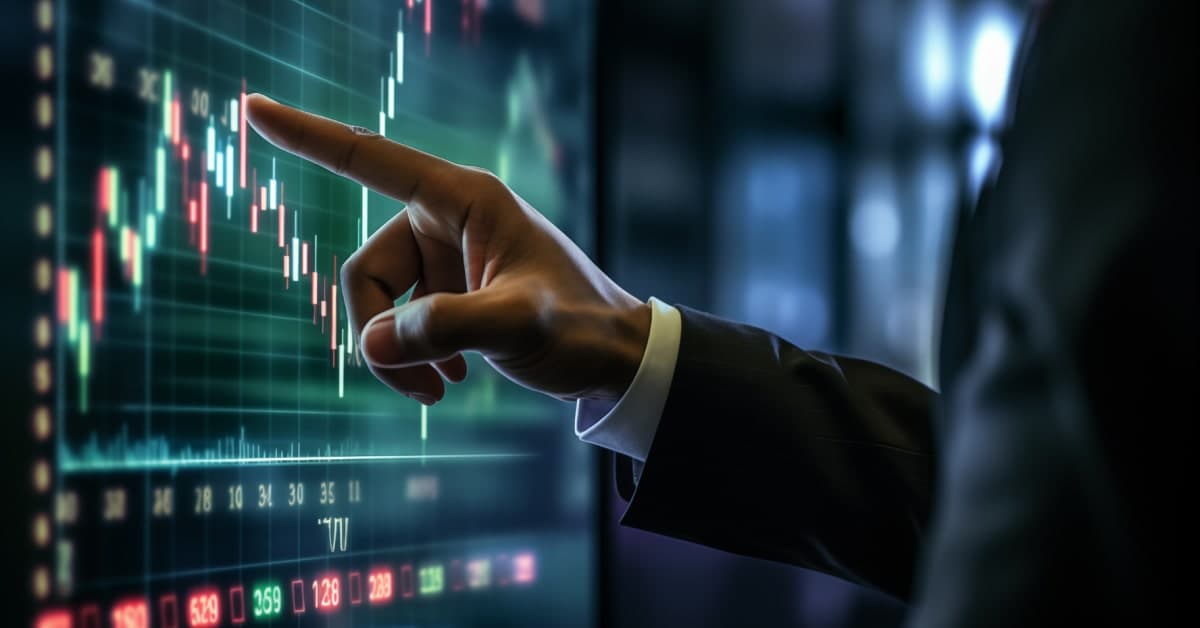 hand pointing to screen with trading data.jpg